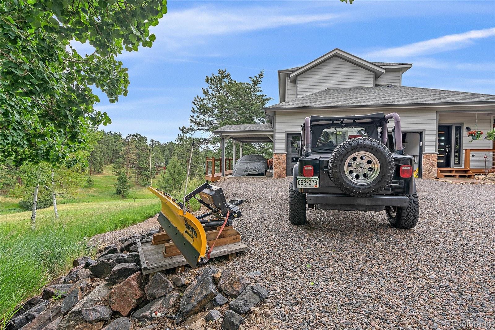 31518 Niakwa Road Evergreen, CO 80439 - Photo 44 of 48 a view of a car in front of a house