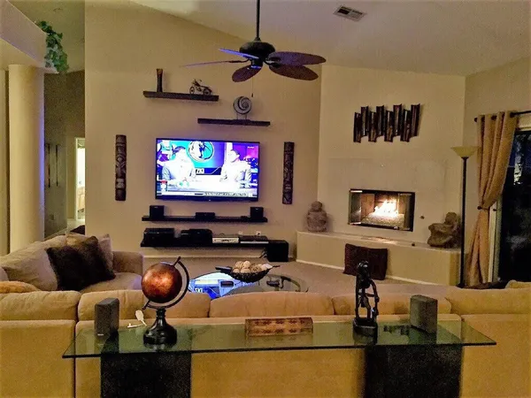 a living room with furniture and a flat screen tv