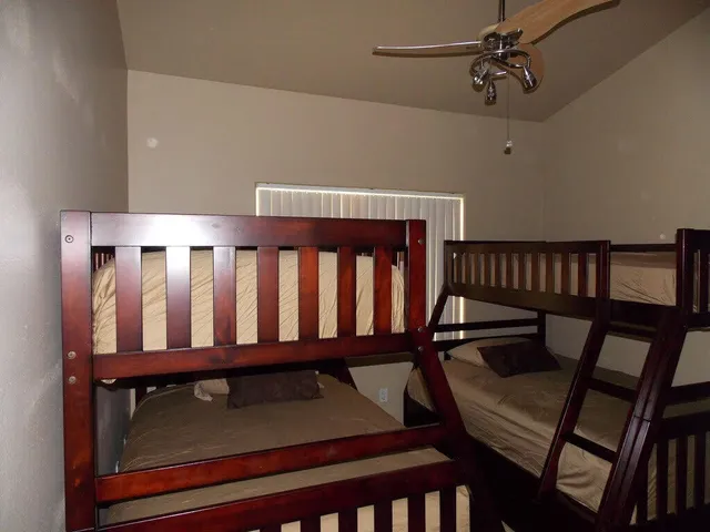 a view of a bedroom with furniture