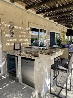 a kitchen with stainless steel appliances granite countertop a stove and a refrigerator
