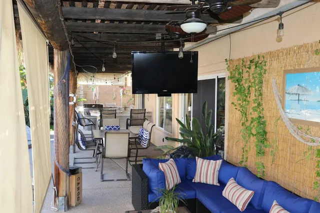 a view of a dining room with furniture and a potted plant
