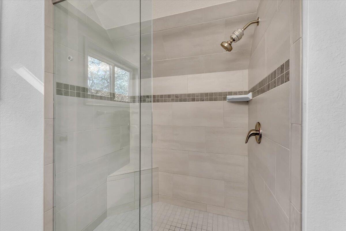 15745 Montgomery Ranch Road Redding, CA 96001 - Photo 15 of 33 a bathroom with a glass shower door