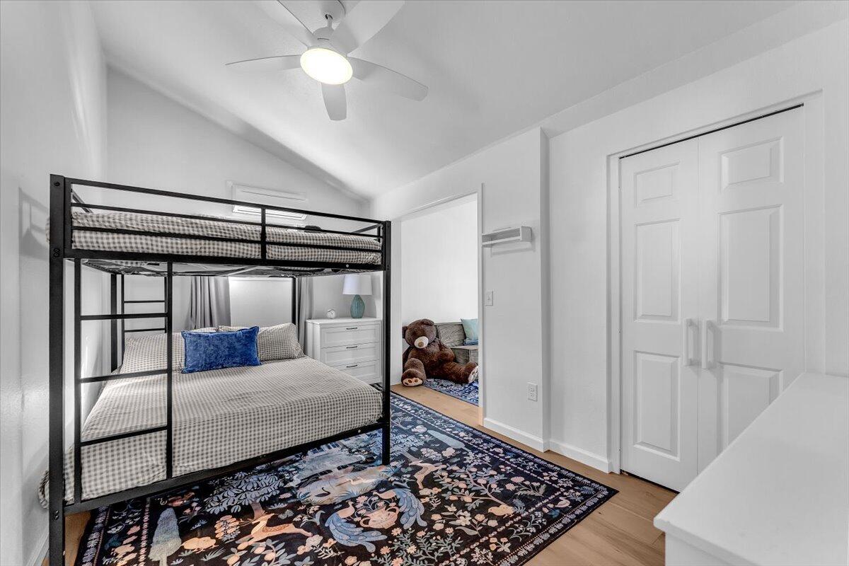 15745 Montgomery Ranch Road Redding, CA 96001 - Photo 17 of 33 a bedroom with a bed and a walk in closet