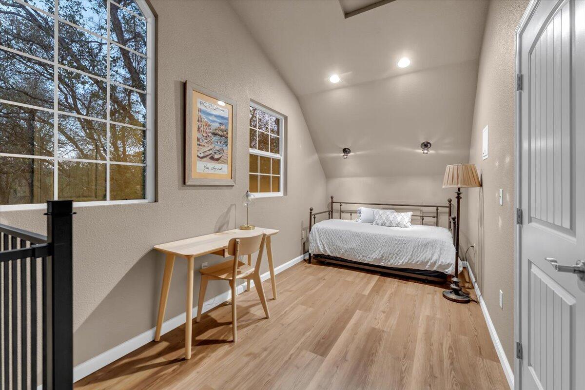 15745 Montgomery Ranch Road Redding, CA 96001 - Photo 29 of 33 a bedroom with a bed and a table in it