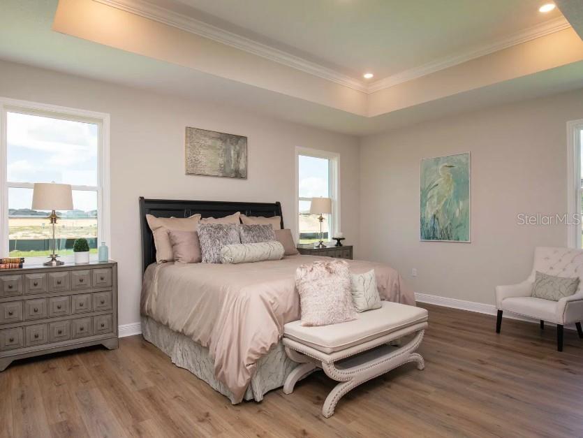 4021 Maggie Loop Lakeland, FL 33813 - Photo 13 of 29 a spacious bedroom with a bed and a window