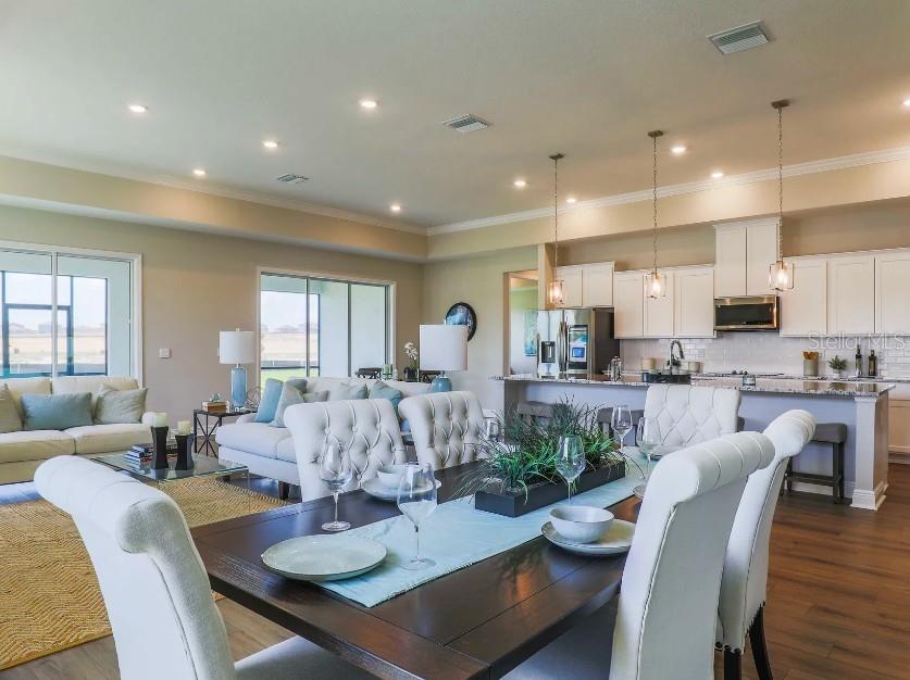 4021 Maggie Loop Lakeland, FL 33813 - Photo 9 of 29 a view of kitchen with dining table and chairs