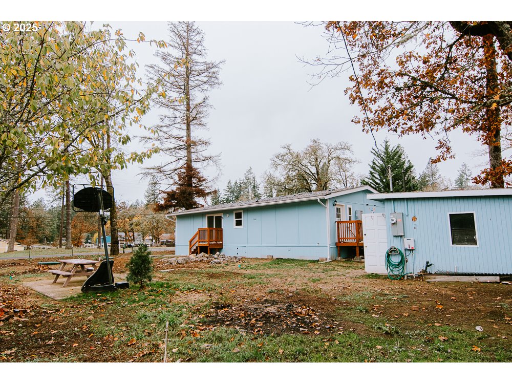 88247 Ellmaker Road Veneta, OR 97487 - Photo 11 of 47 a house view with a backyard space