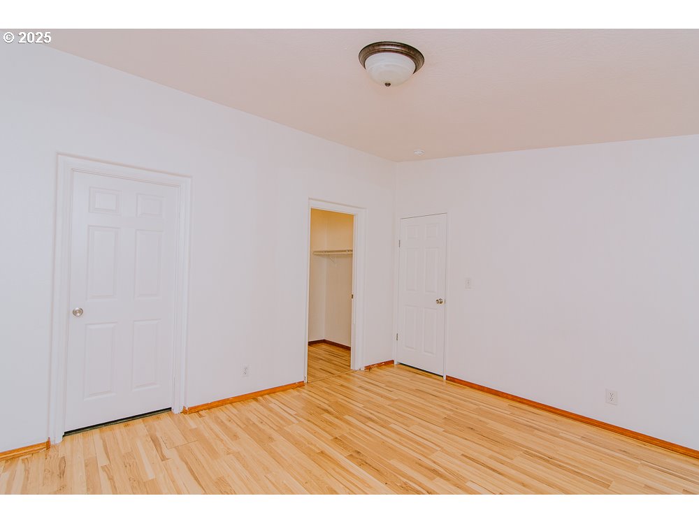 88247 Ellmaker Road Veneta, OR 97487 - Photo 34 of 47 a view of empty room with wooden floor