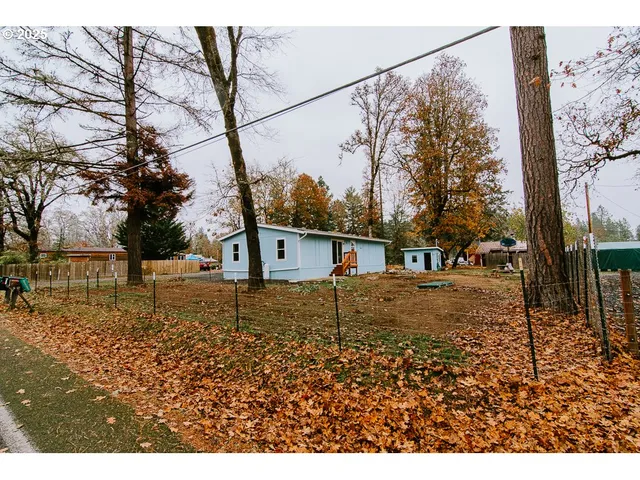 a house view with a backyard space