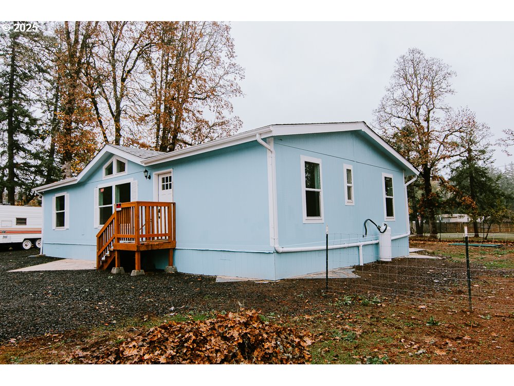 88247 Ellmaker Road Veneta, OR 97487 - Photo 6 of 47 a house view with a backyard space