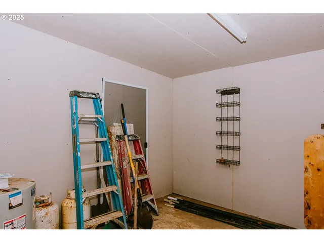 a backyard of a house with barbeque oven