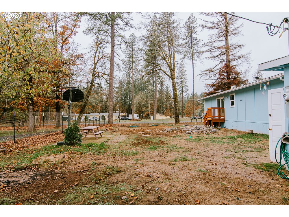 88247 Ellmaker Road Veneta, OR 97487 - Photo 10 of 47 a backyard of a house with barbeque oven