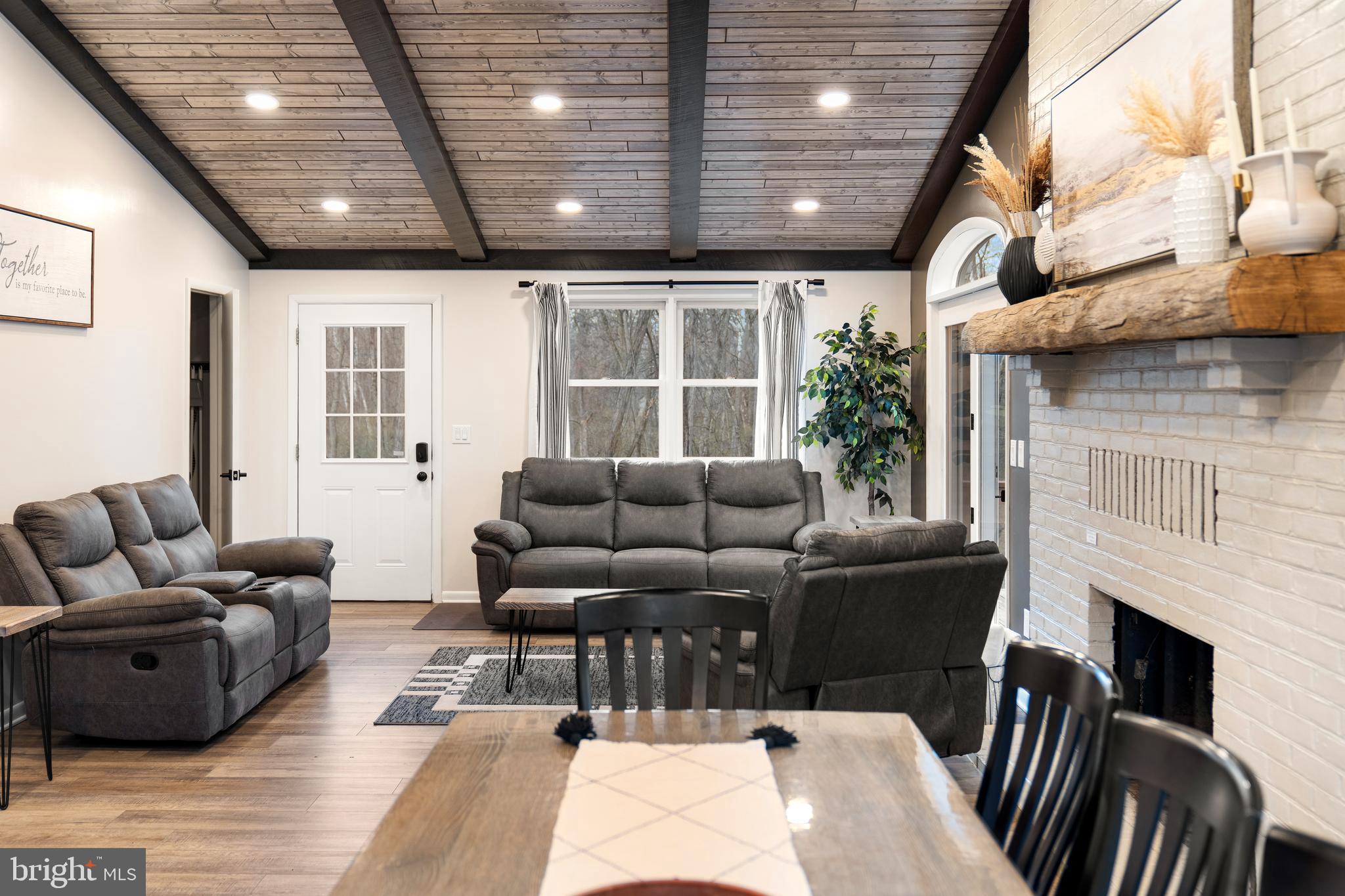 158 Juniata Division Road Lewistown, PA 17044 - Photo 16 of 70 a living room with furniture a fireplace and a table