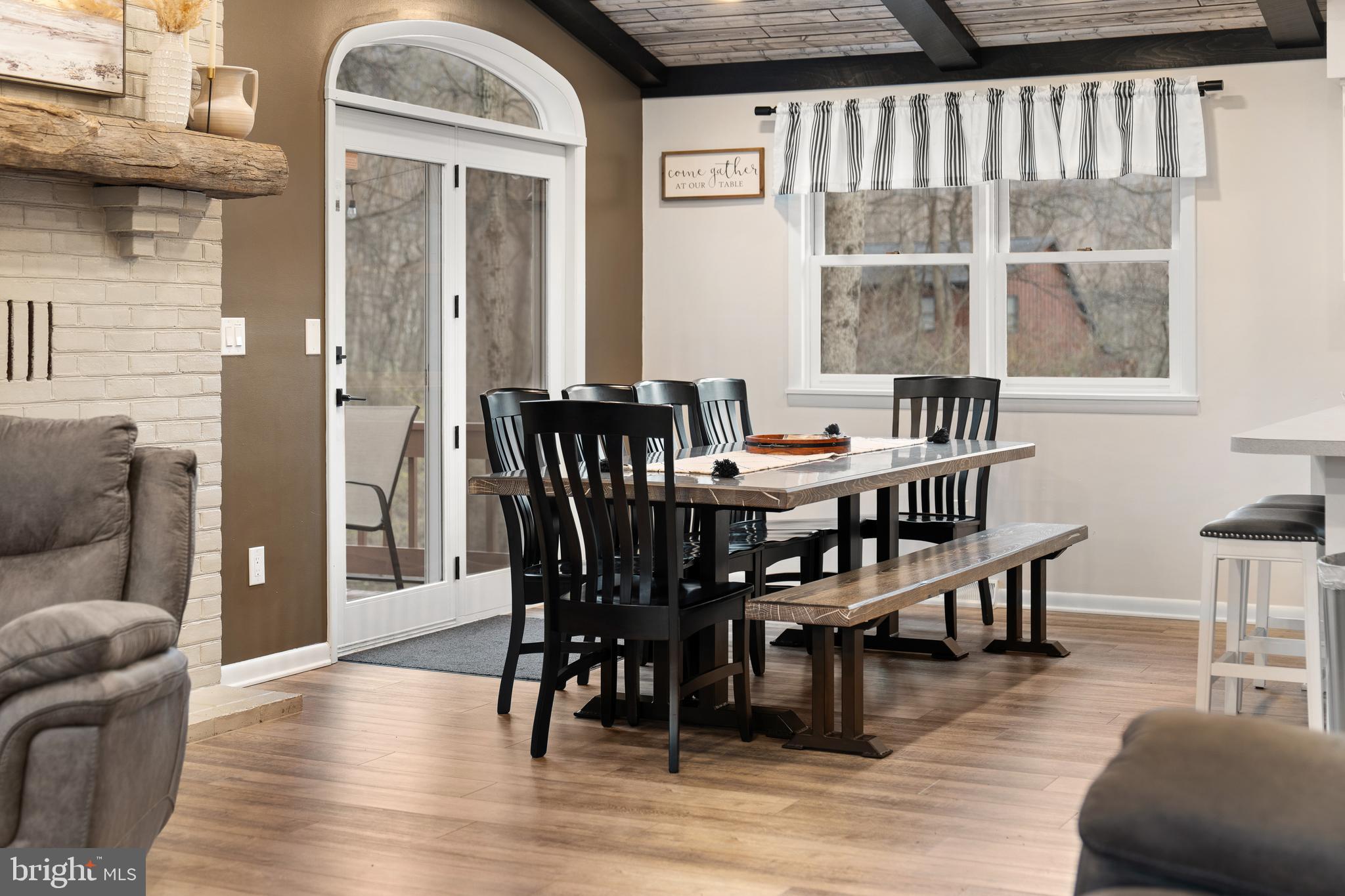 158 Juniata Division Road Lewistown, PA 17044 - Photo 18 of 70 a view of a dining room with furniture window and wooden floor