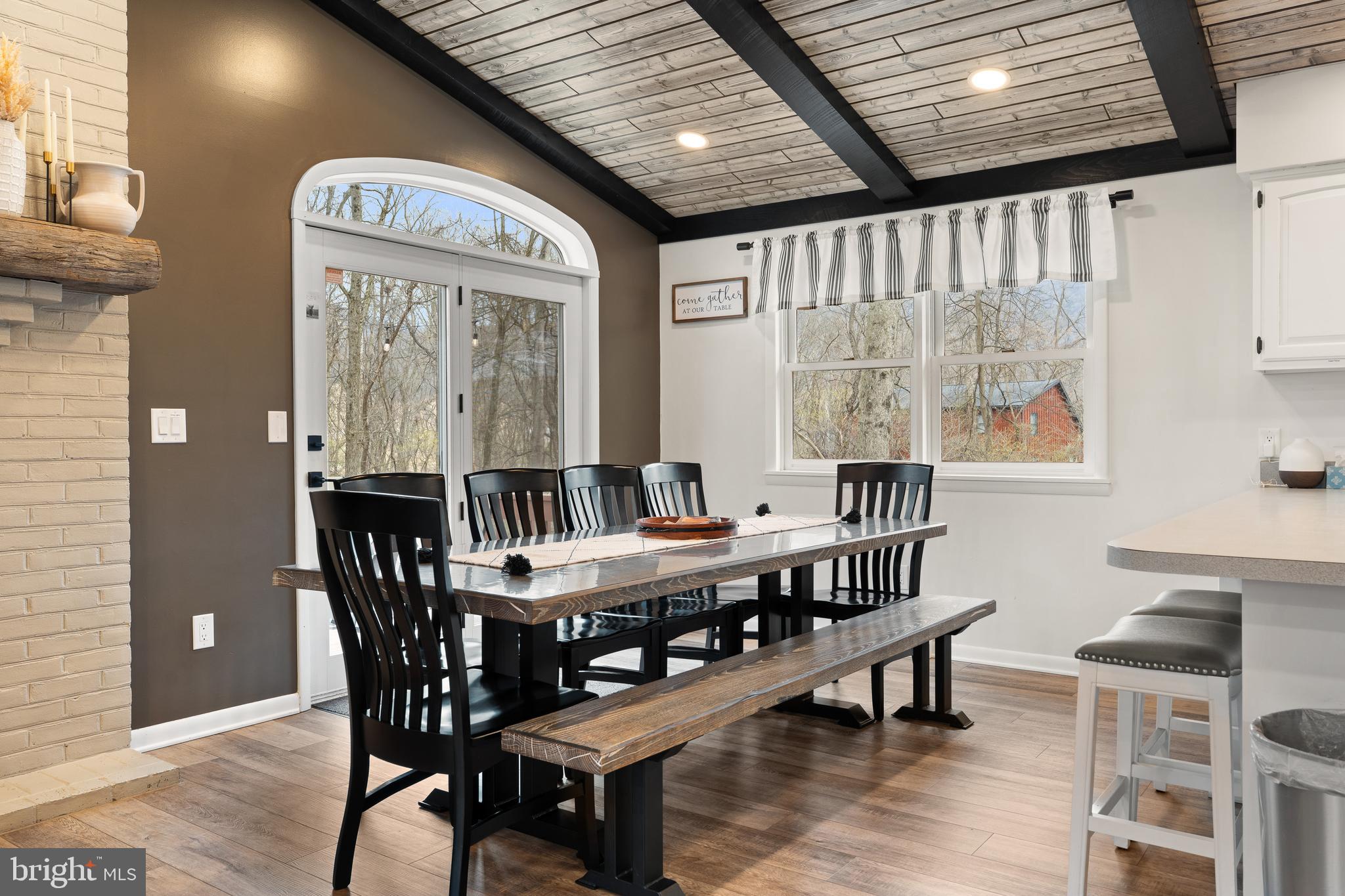 158 Juniata Division Road Lewistown, PA 17044 - Photo 21 of 70 a dining room with furniture a rug and a large window