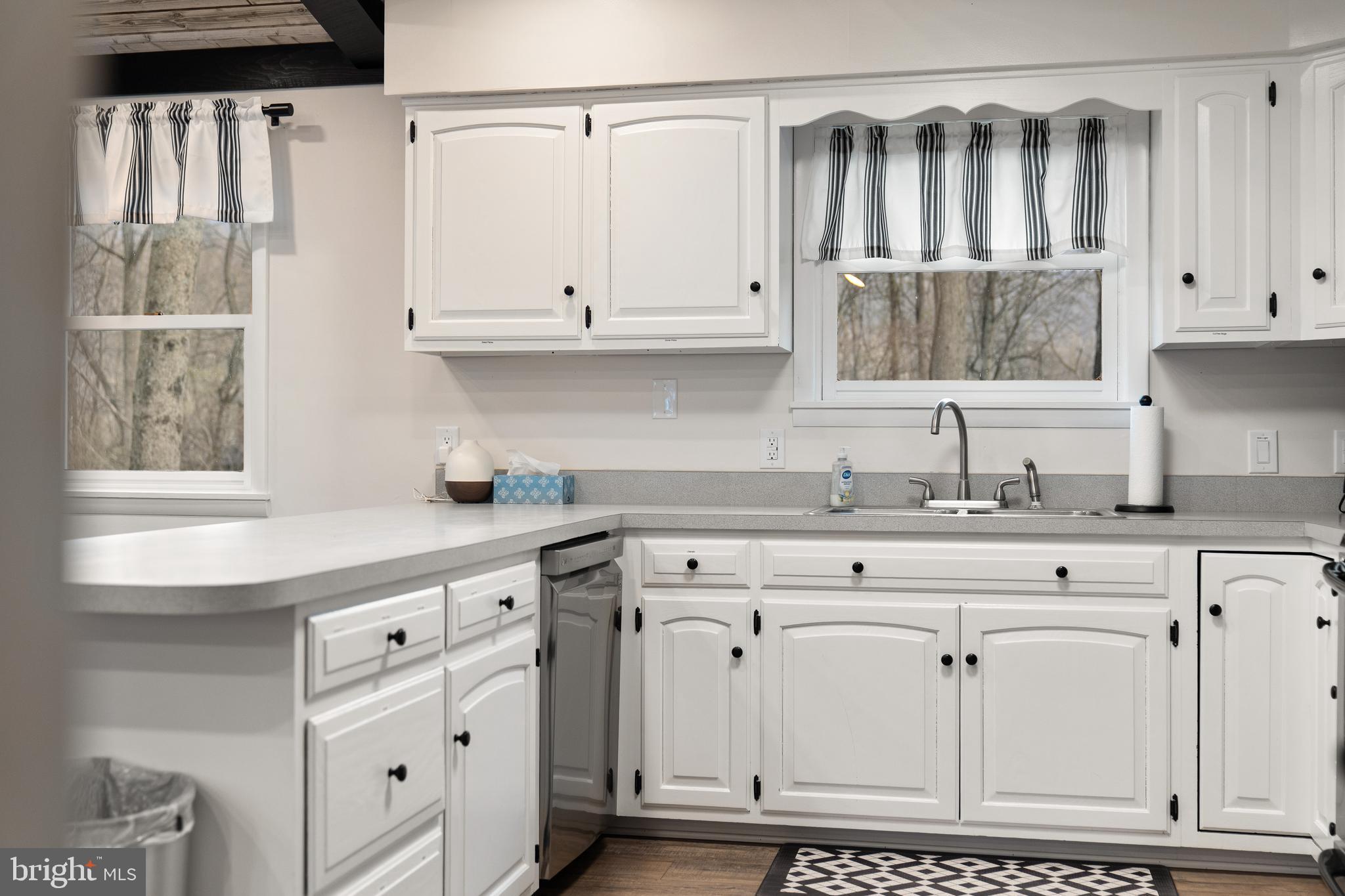 158 Juniata Division Road Lewistown, PA 17044 - Photo 27 of 70 a kitchen with white cabinets and window
