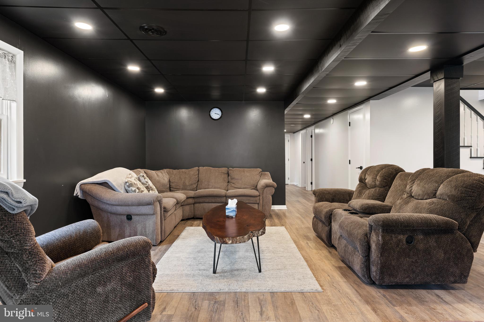 158 Juniata Division Road Lewistown, PA 17044 - Photo 43 of 70 a media room with furniture a rug and a projector