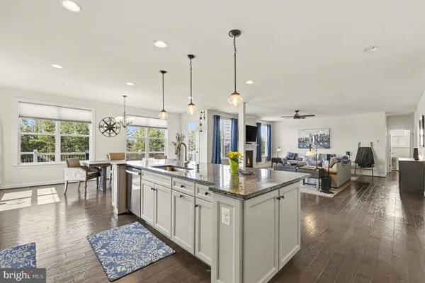 a living room with furniture a window and a flat screen tv