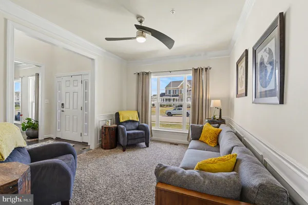 a bedroom with a bed furniture and a large window
