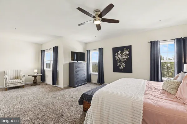 a bathroom with a sink vanity mirror and toilet