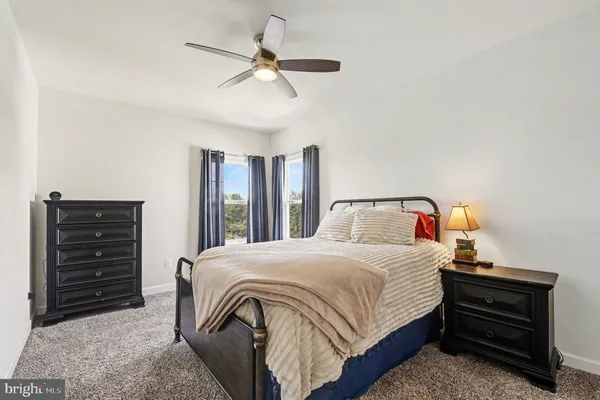 a view of a swimming pool with sitting area