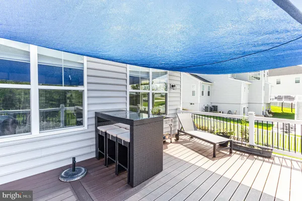a view of a chair and table in the garden