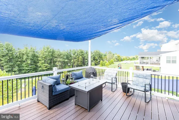 an aerial view of residential houses with outdoor space and swimming pool