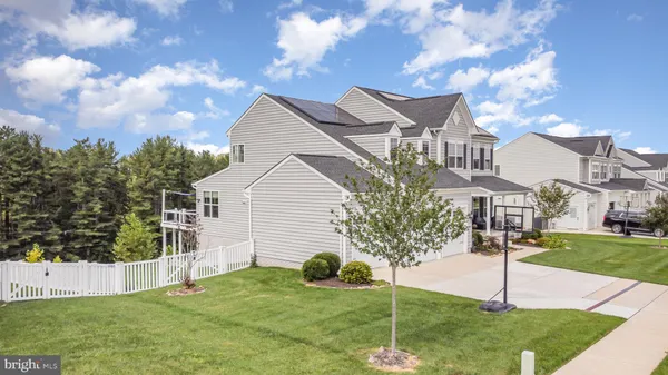 a living room with furniture flat screen tv and a fireplace