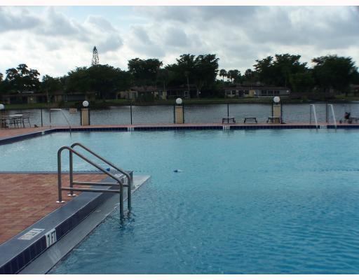 100 Berkley Road, Unit 105 Hollywood, FL 33024 - Photo 13 of 18 a view of outdoor space with lake view