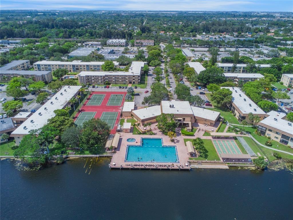 100 Berkley Road, Unit 105 Hollywood, FL 33024 - Photo 9 of 18 an aerial view of residential houses with outdoor space and parking