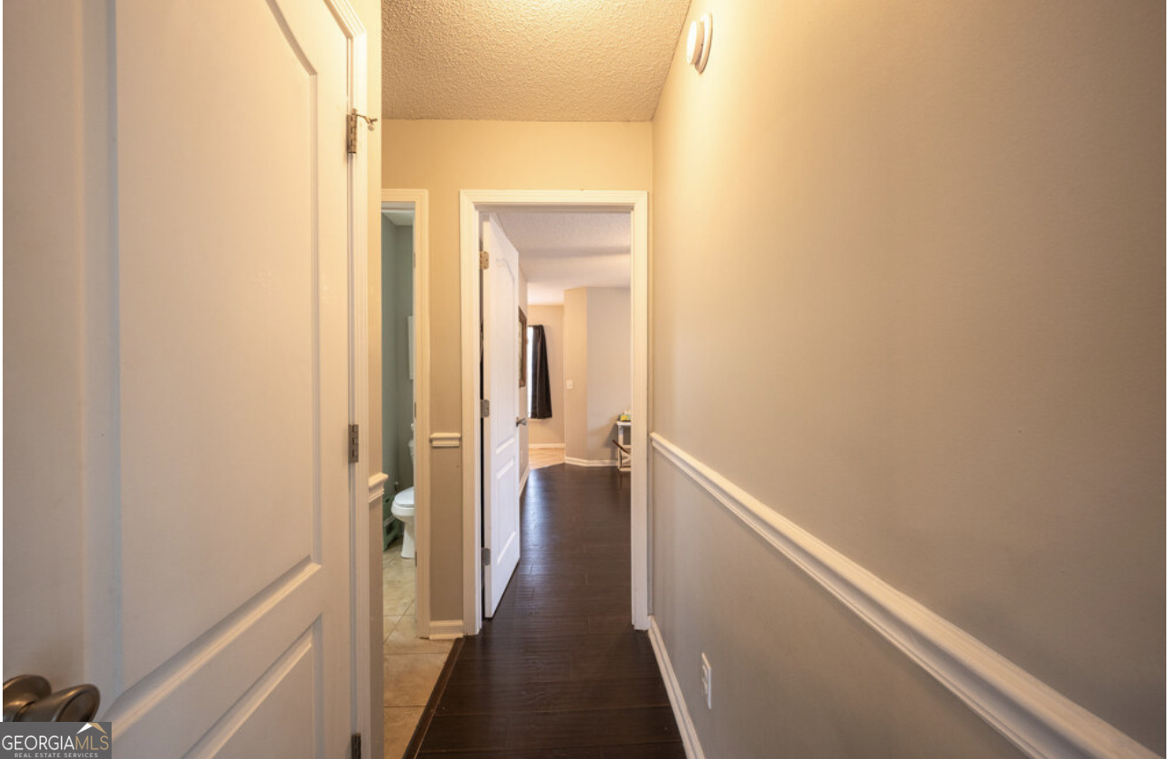 59 Laurel Way Ludowici, GA 31316 - Photo 11 of 21 a view of a hallway with a wooden floor