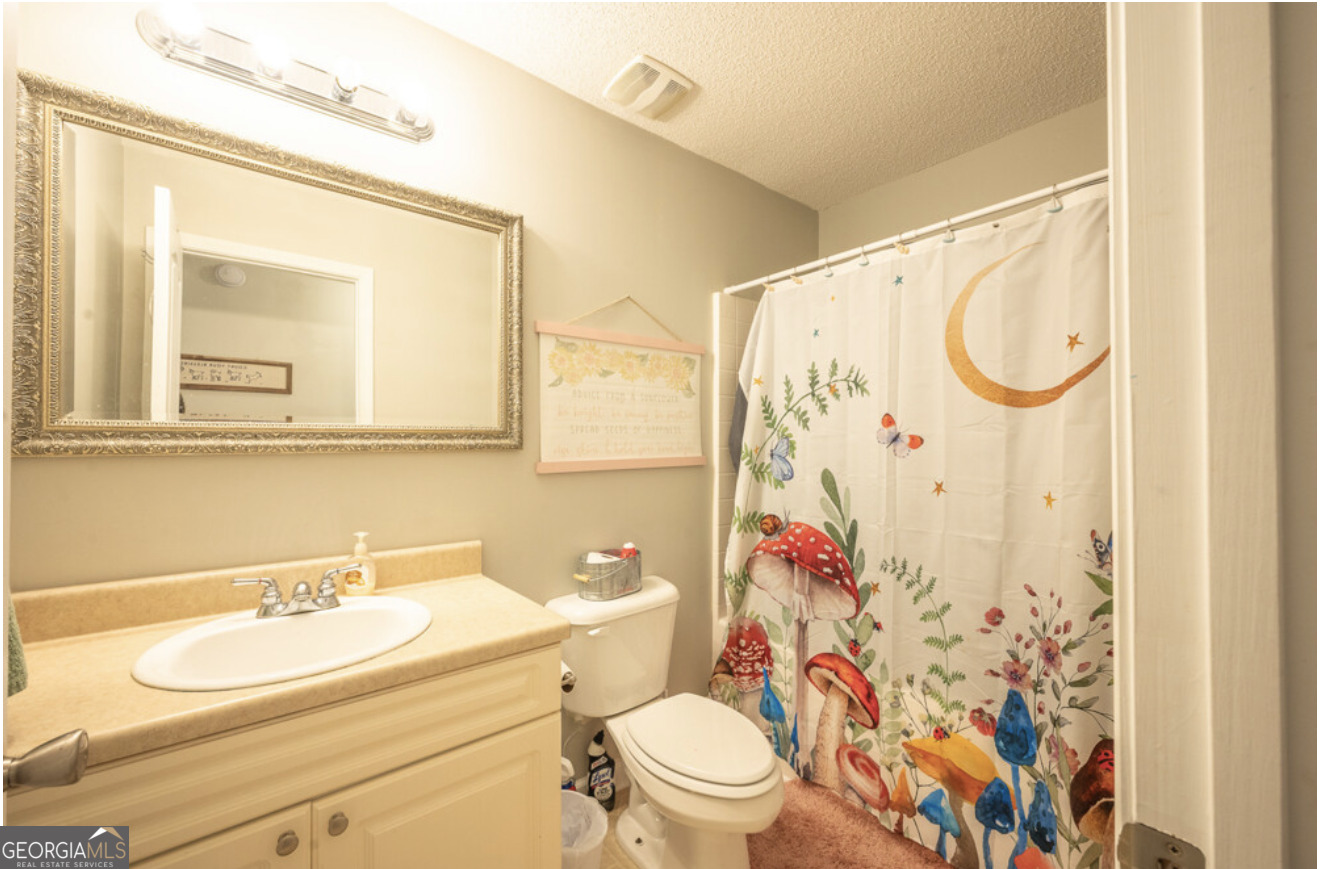 59 Laurel Way Ludowici, GA 31316 - Photo 15 of 21 a bathroom with a sink toilet and shower