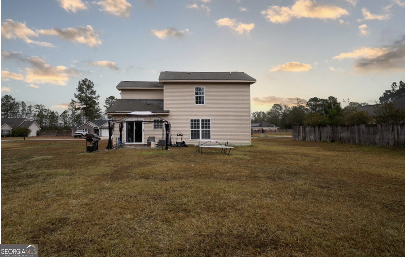 59 Laurel Way Ludowici, GA 31316 - Photo 18 of 21 a view of a house with backyard and trees