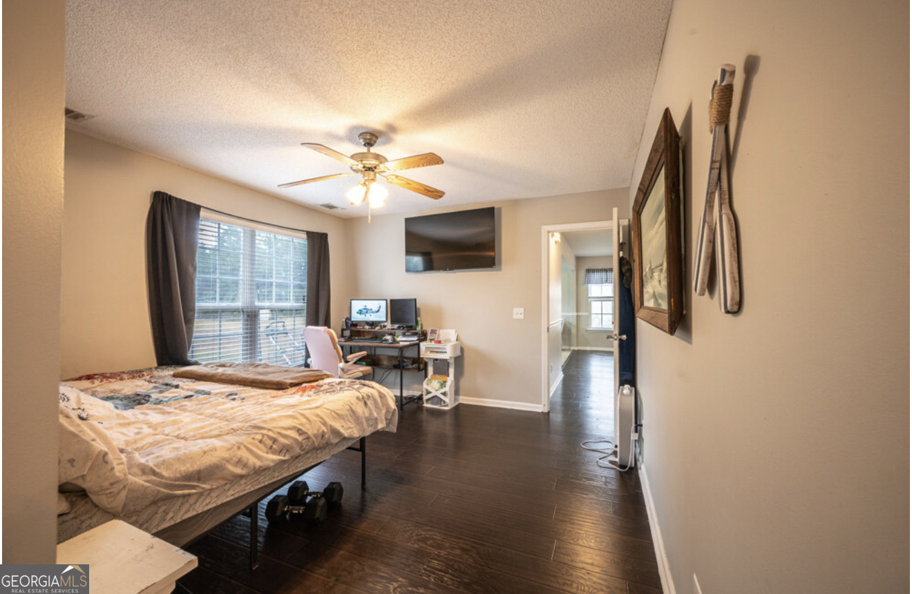 59 Laurel Way Ludowici, GA 31316 - Photo 4 of 21 a bedroom with a bed and a chandelier