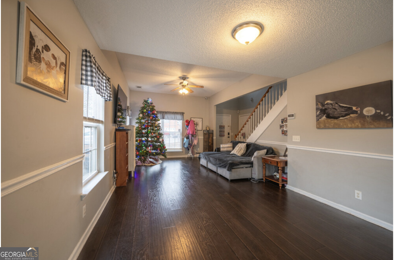 59 Laurel Way Ludowici, GA 31316 - Photo 10 of 21 a view of a livingroom with wooden floor and stairs