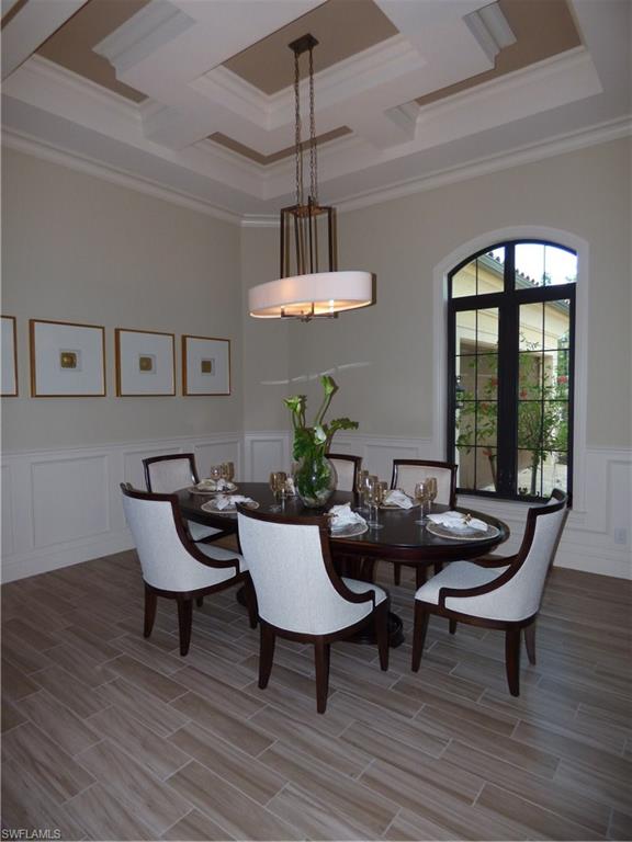 6376 Burnham Road Naples, FL 34119 - Photo 11 of 23 a view of a dining room with furniture window and wooden floor