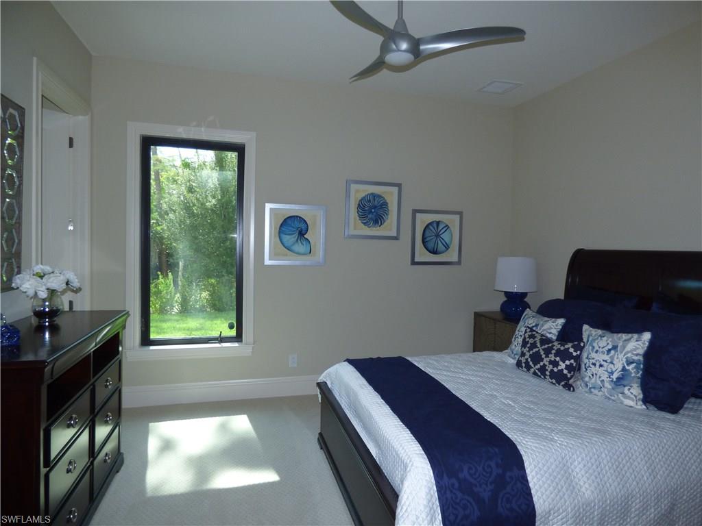 6376 Burnham Road Naples, FL 34119 - Photo 14 of 23 a bedroom with a bed and a window