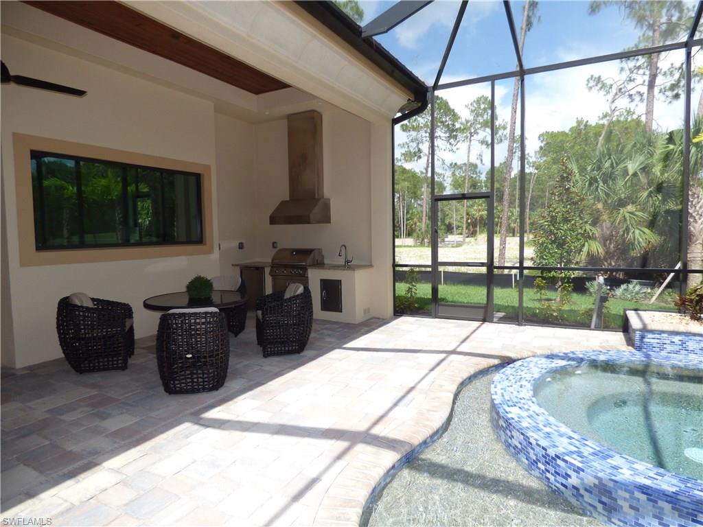 6376 Burnham Road Naples, FL 34119 - Photo 16 of 23 a living room with furniture