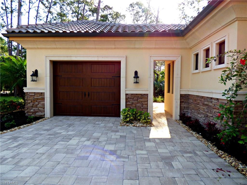 6376 Burnham Road Naples, FL 34119 - Photo 21 of 23 a front view of a house with a yard