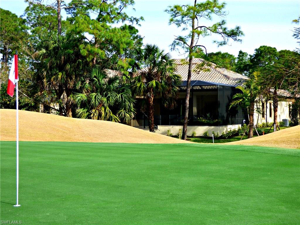 6376 Burnham Road Naples, FL 34119 - Photo 23 of 23 a view of a house with a yard