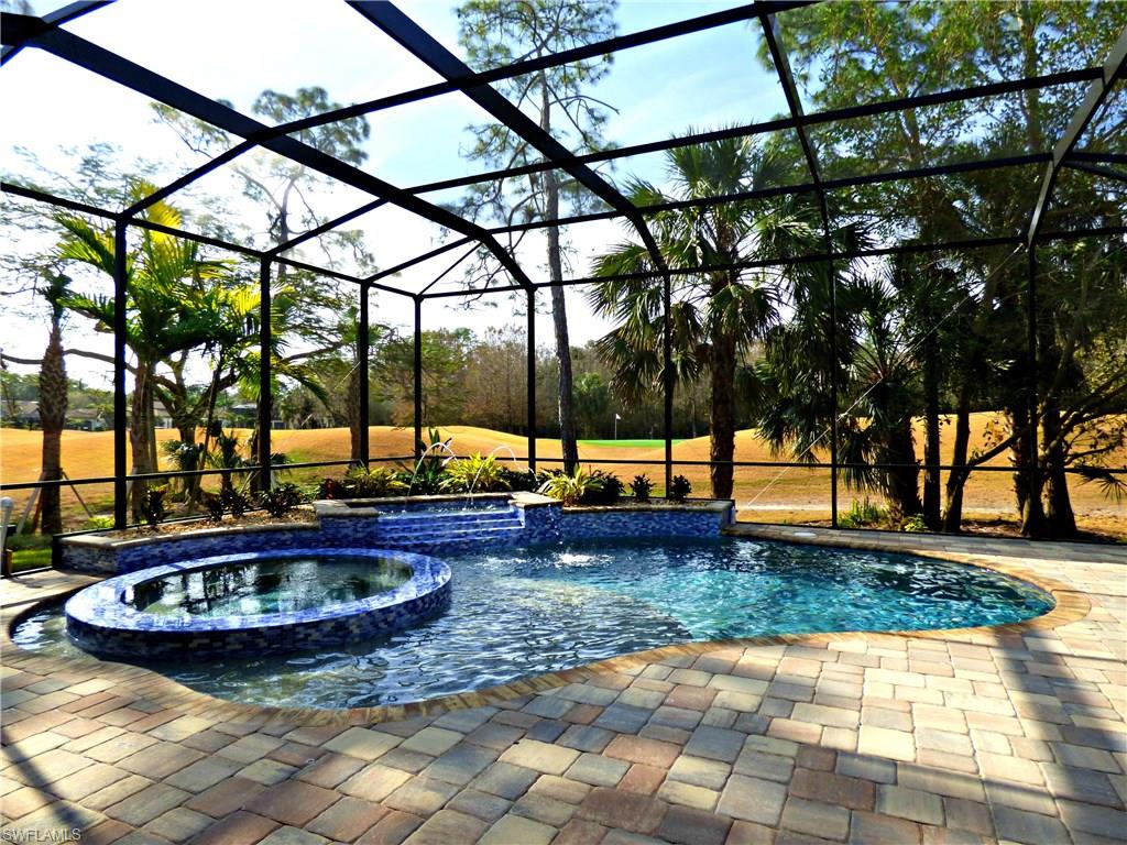 6376 Burnham Road Naples, FL 34119 - Photo 8 of 23 a view of a swimming pool with a patio