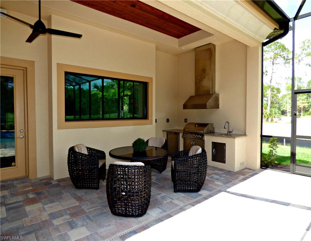 6376 Burnham Road Naples, FL 34119 - Photo 10 of 23 a couple of chairs sitting in front of a door