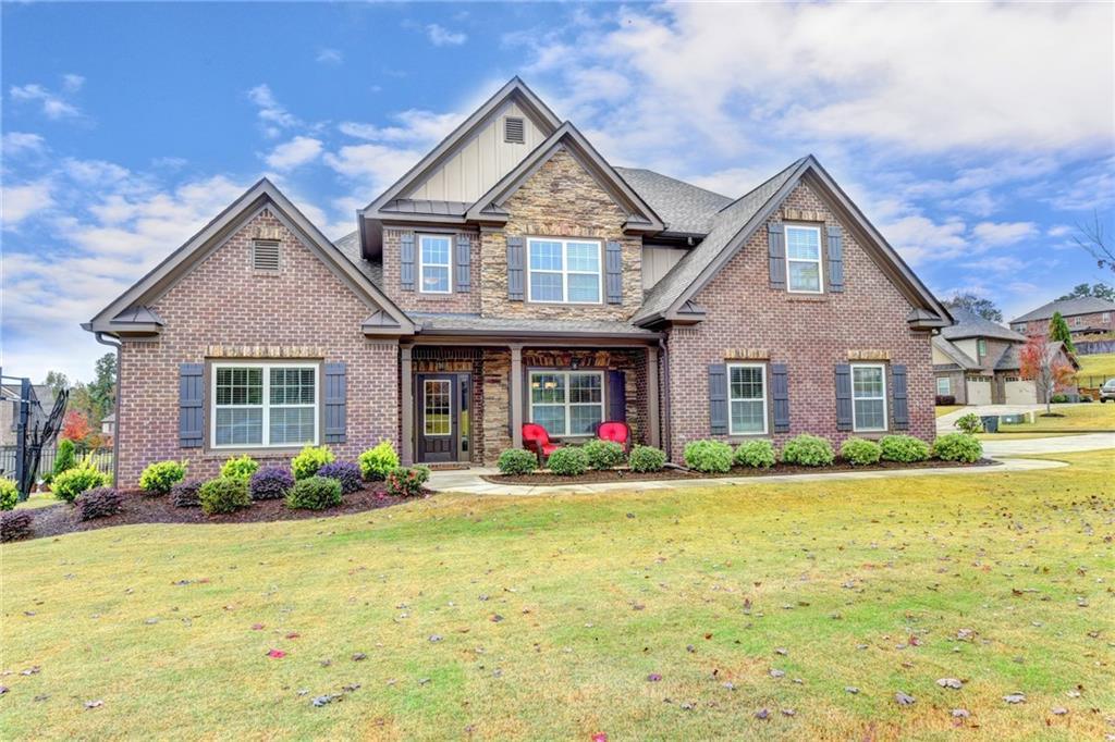 409 Apple Tree Way Buford, GA 30518 - Photo 1 of 1 4 sided brick home with some stone accents and irrigation system