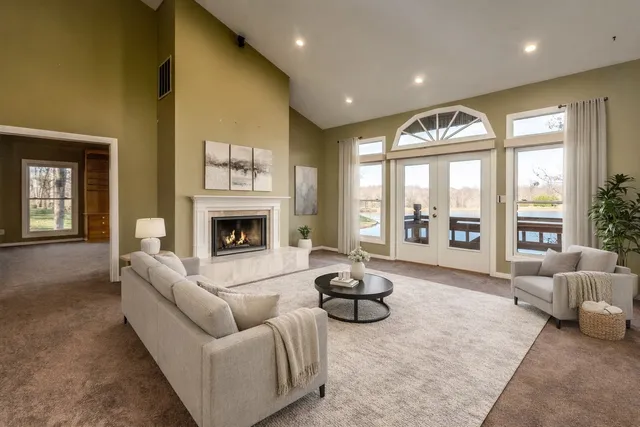 a living room with furniture and a book shelf