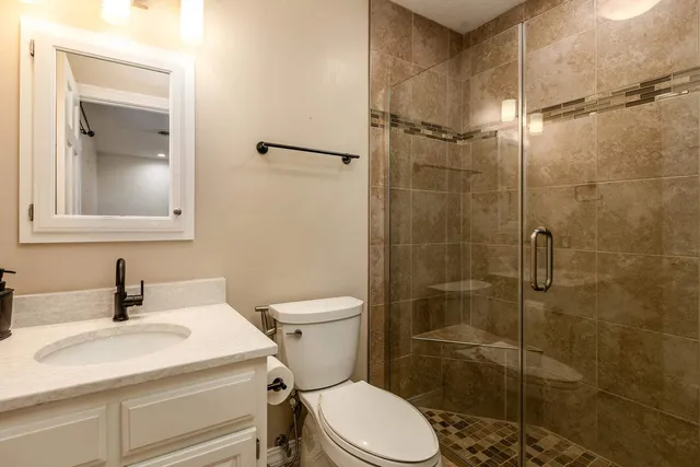 a spacious bedroom with a bed and furniture