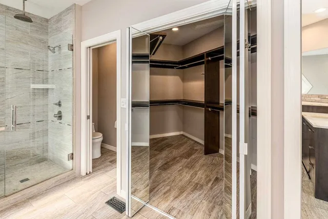 a view of a room with wooden floor