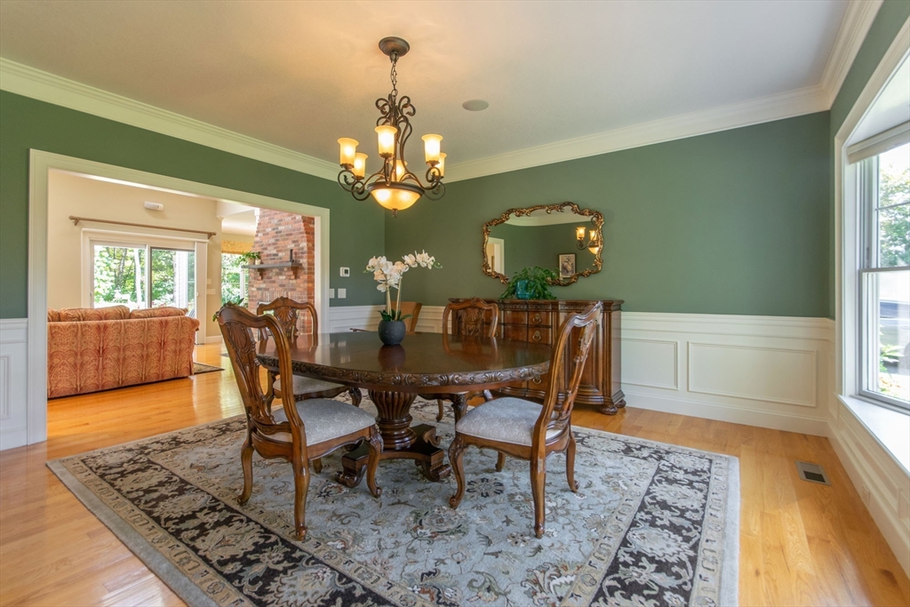 7 Western View Road Holyoke, MA 01040 - Photo 23 of 42 a dining room with furniture a rug and a chandelier