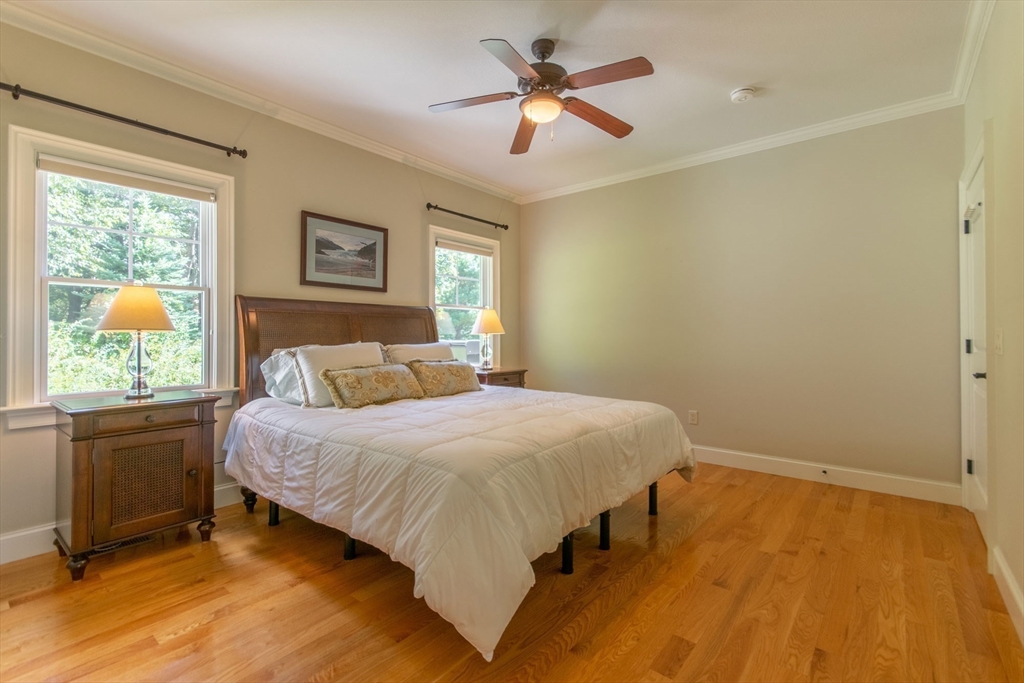 7 Western View Road Holyoke, MA 01040 - Photo 29 of 42 a bedroom with a bed and a chandelier