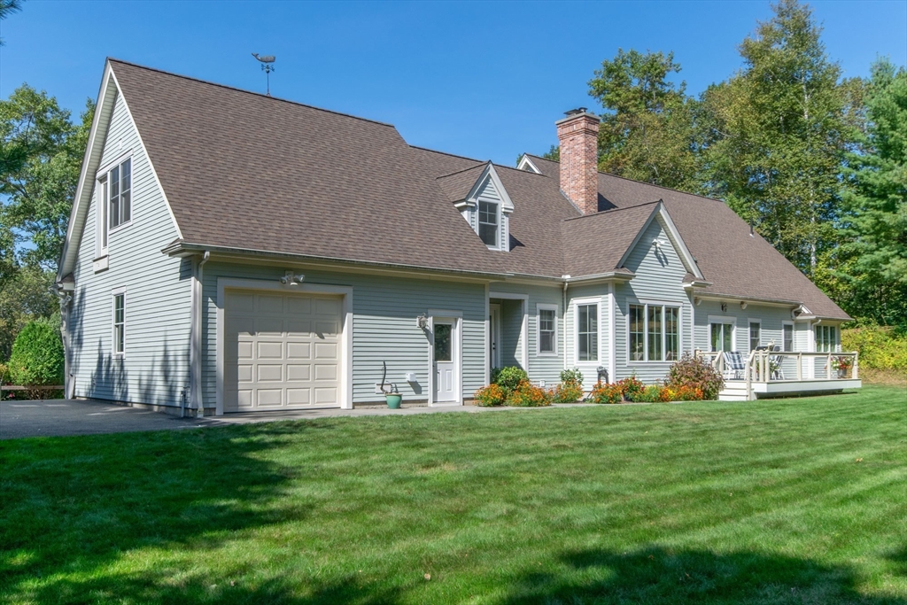 7 Western View Road Holyoke, MA 01040 - Photo 5 of 42 a front view of a house with a garden and plants