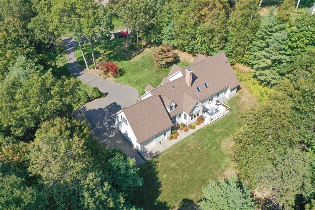 7 Western View Road Holyoke, MA 01040 - Photo 8 of 42 an aerial view of a house with a yard and trees all around